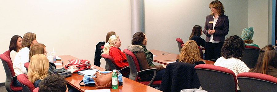 Faculty member with a class in the library